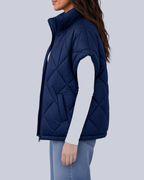 Women's Oversized Padded Gilet with Diamond Quilting and High Neck in Navy – Side View